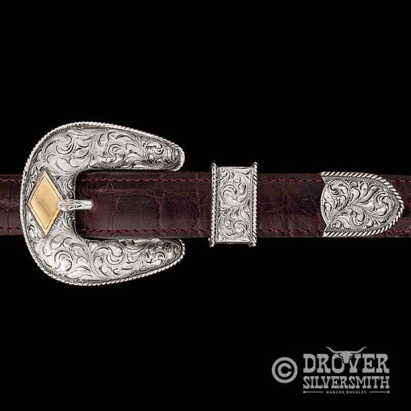 This three piece belt buckle set is the standard of Western Elegance.  Each piece is built custom with up to 4 letters engraved onto the Jeweler's Bronze diamond. 